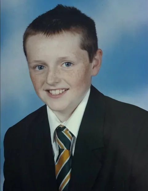 Tom's school portrait, in blazer and tie