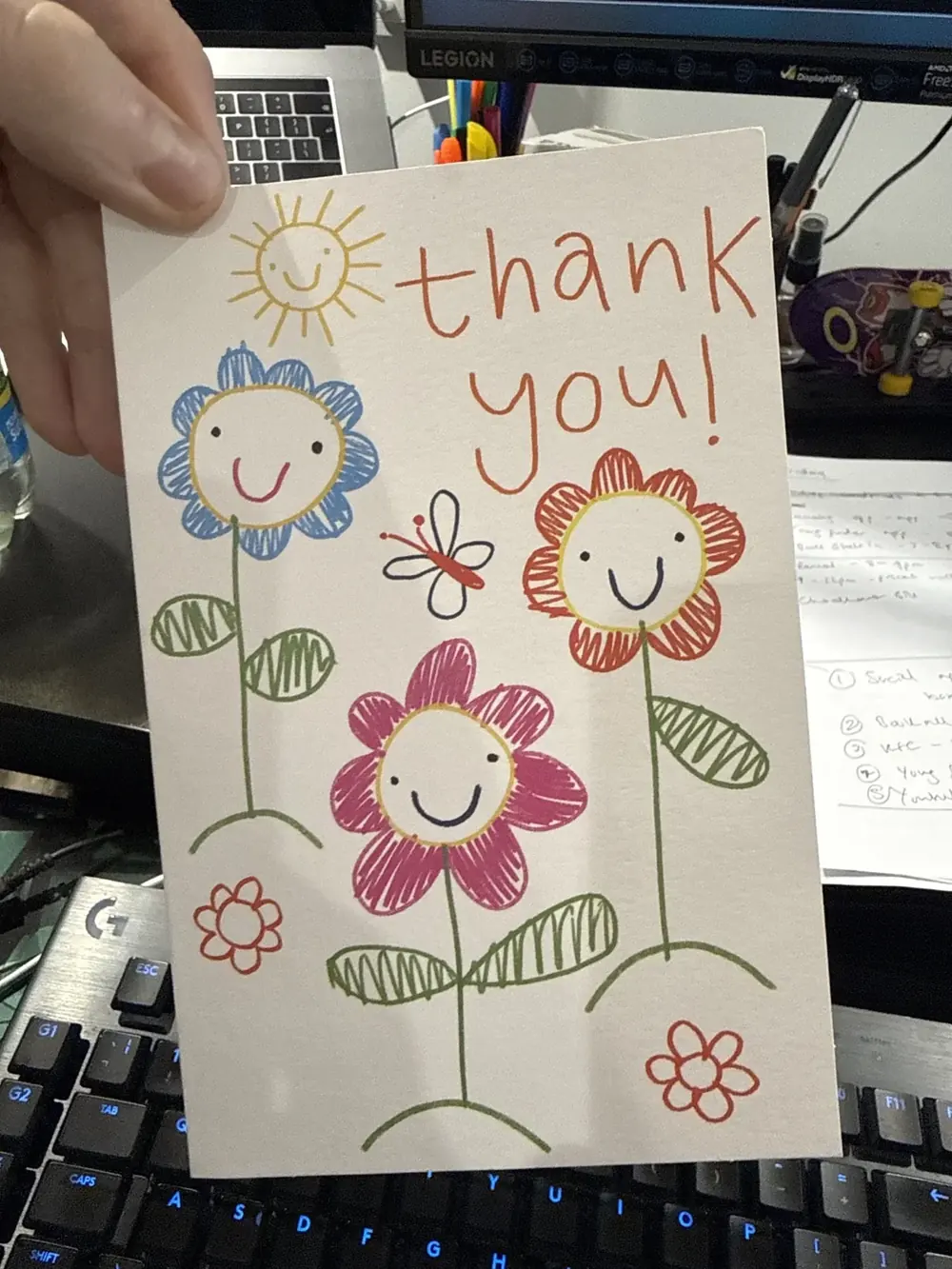 The front of a thank-you card with hand-drawn flowers