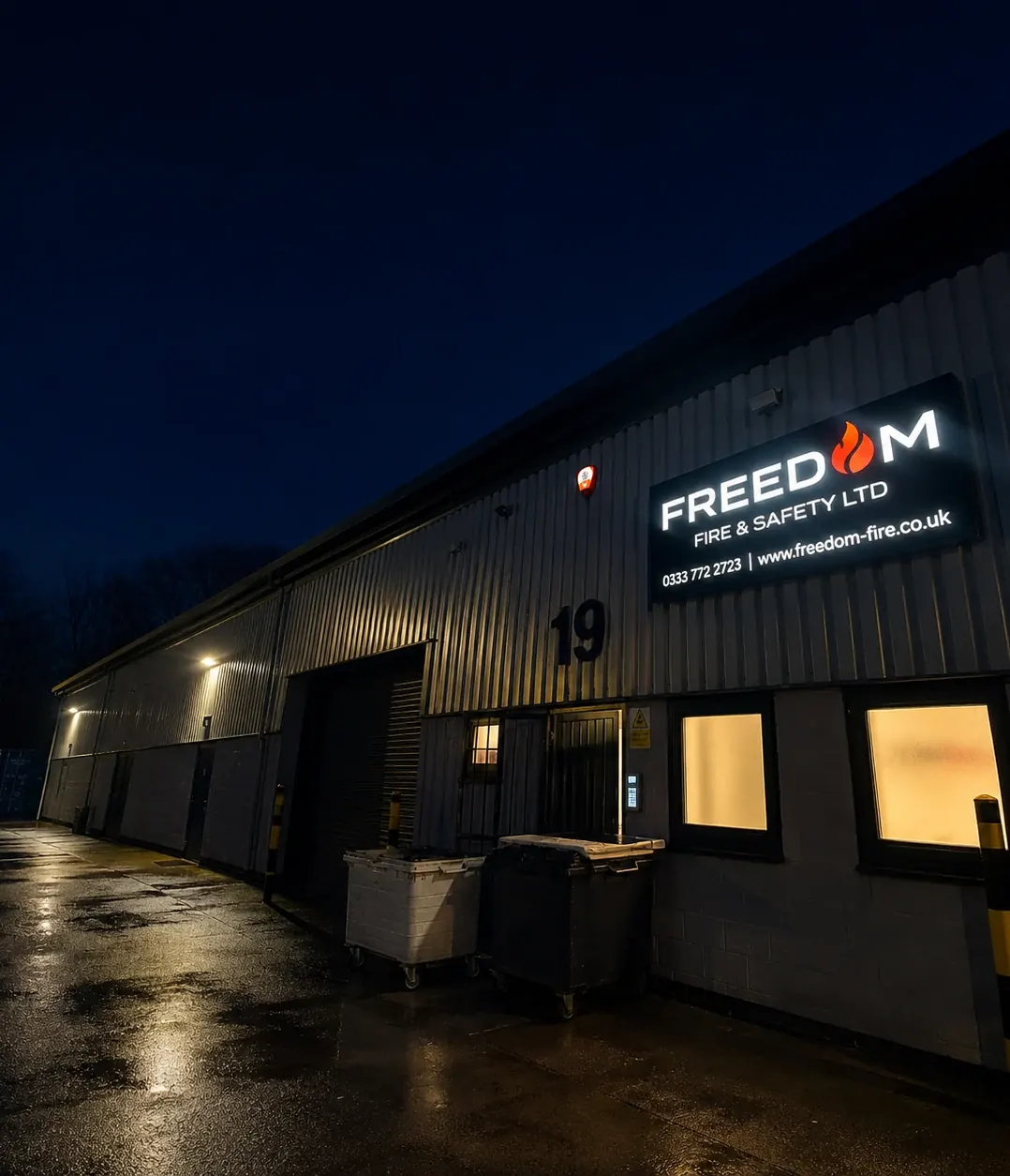 Unit 19 at night with the sign lit