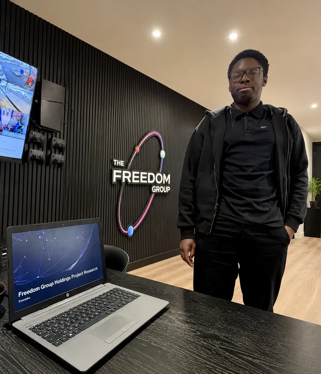 Bill presenting the Freedom Group project at the weekly meeting, the new website on the laptop